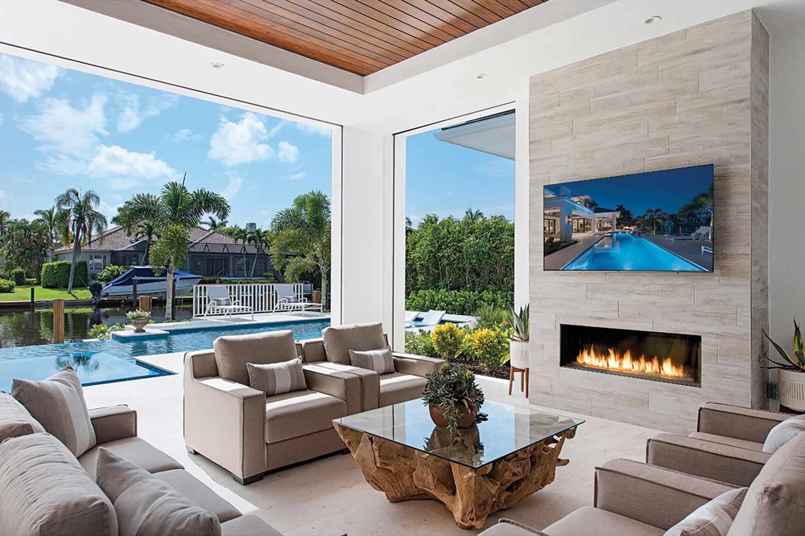Covered patio with fireplace and outdoor TV