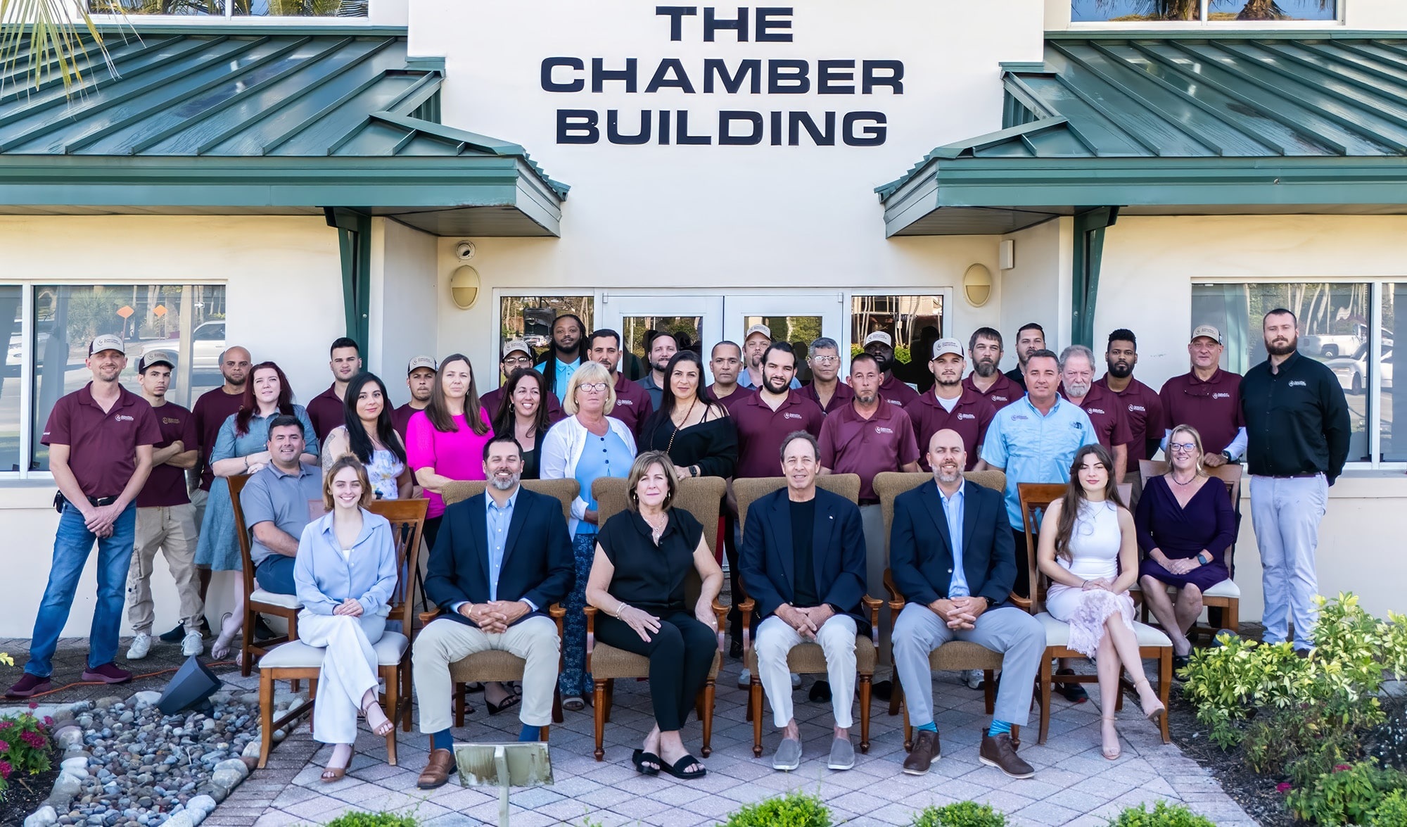 The Executive Electronics team gathered outside their Southwest Florida office